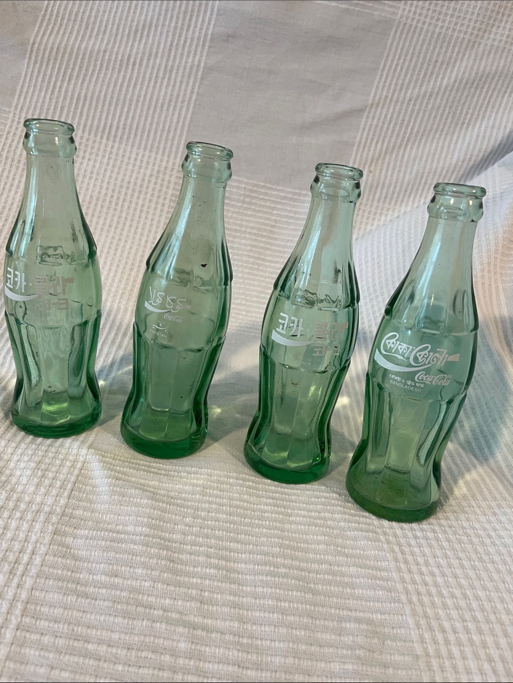 Coca Cola light green glass bottles - set of 4 Korea, Pakistan, Bangladesh